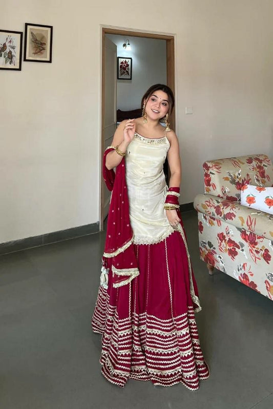 Classic Ethnic Contrast: Ivory Strappy Kurti with Deep Maroon Festive Skirt