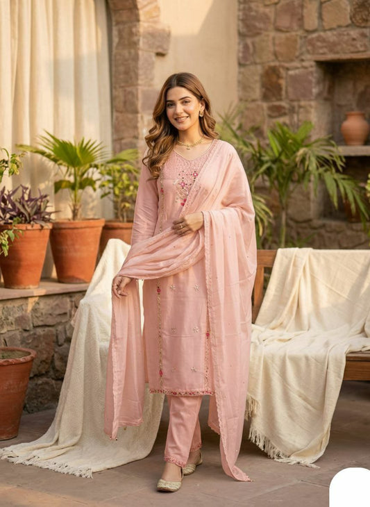 The embroidery style appears to be a mix of traditional Indian techniques, incorporating. The design is elegant and timeless, with a touch of traditional Indian artistry.