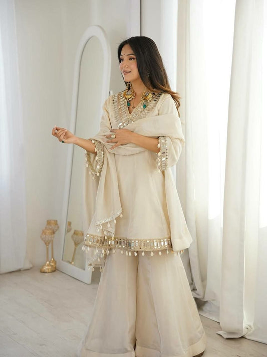 Exquisite Cream Organza Sharara Set with Mirror Work and Cowrie