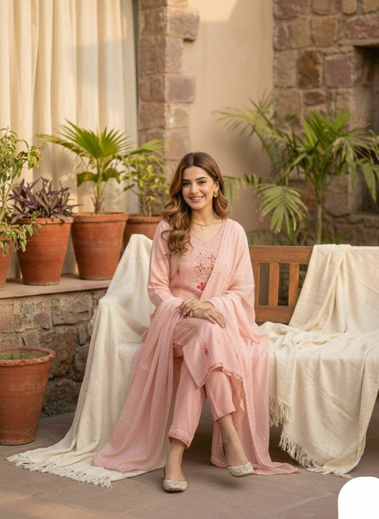 The embroidery style appears to be a mix of traditional Indian techniques, incorporating. The design is elegant and timeless, with a touch of traditional Indian artistry.